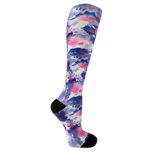 Dr. Scholl's women's compression socks featuring a blue, pink and white tie dye pattern and black accents at the heel and toe.