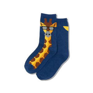 Child wearing blue socks with a giraffe pattern, sitting on a white radiator.