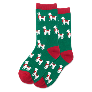 A pair of kid's holiday-themed crew socks with a pattern of llamas in white and green on a red background.