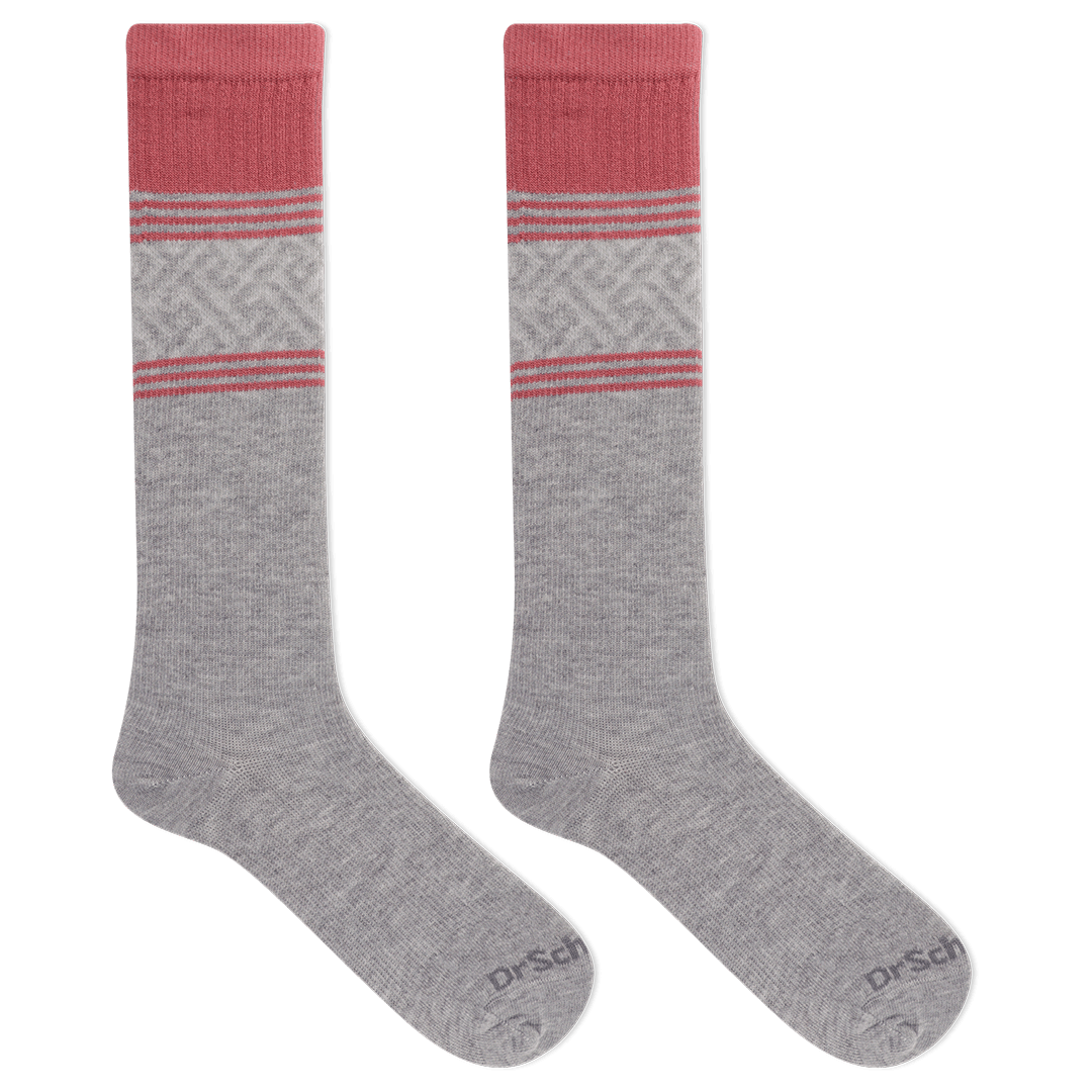 Gray knee-high socks with pink accents on a black background