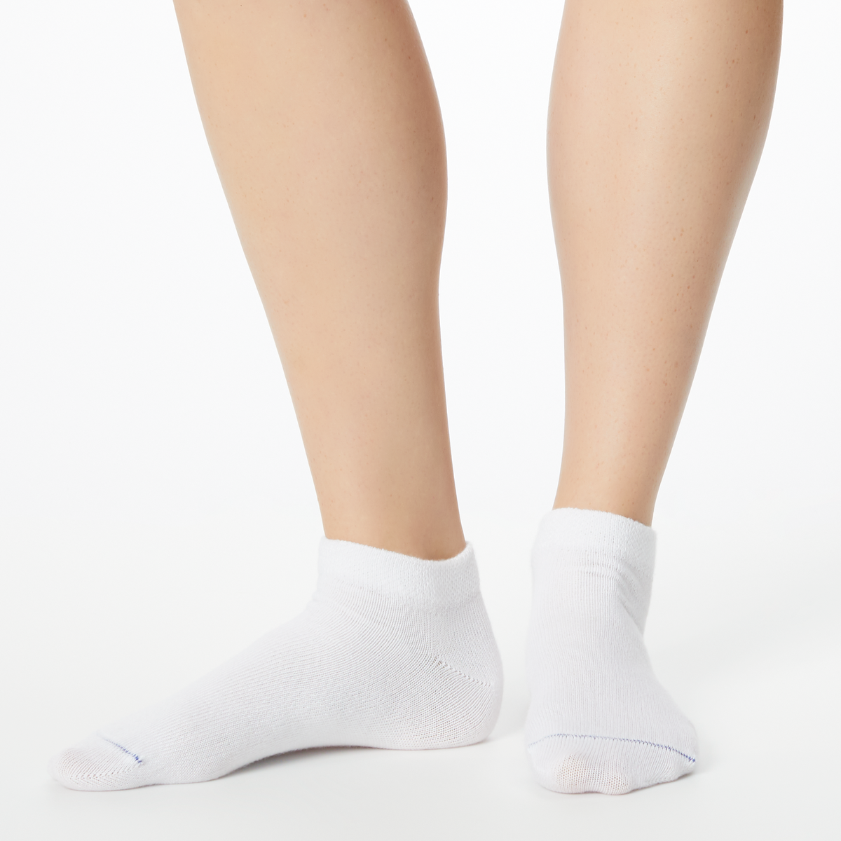 Person wearing solid white Dr. Scholl's ankle socks