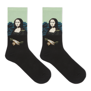 A pair of black crew socks featuring a printed graphic of the Mona Lisa with a light green background and blue mountains.