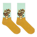 A pair of crew socks featuring a classic Van Gogh-inspired sunflower and chrysanthemum floral print on the upper half, with a solid mustard yellow lower half and a pale mint green cuff.