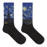 A pair of crew socks with a black lower half and a blue cuff printed with a Van Gogh-inspired swirling night sky design in yellow, white, and black. thumbnail