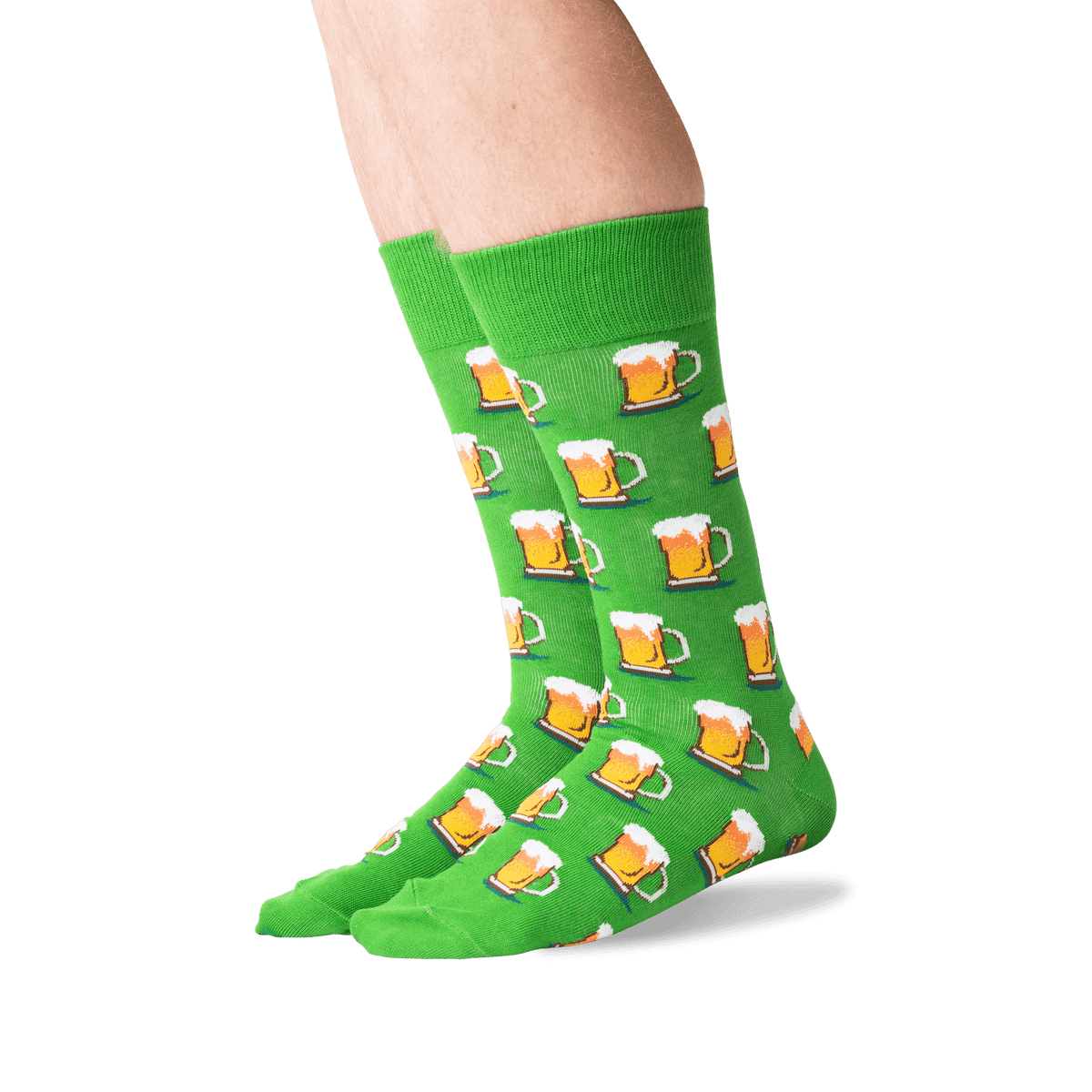 Green socks with beer mug pattern worn by a person on a white background