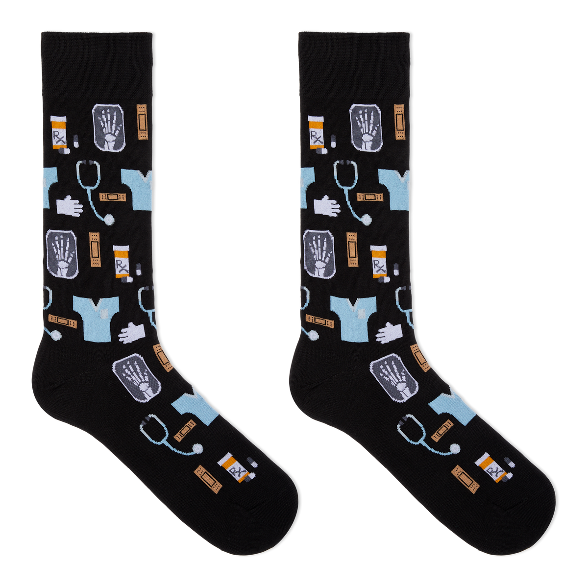 A pair of black crew socks with a medical-themed pattern featuring light blue scrubs, stethoscopes, X-ray images, pills, and hands, displayed against a solid white background.