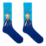 A pair of crew socks featuring a stylized portrait of Vincent van Gogh in blue and beige tones, set against a bright blue background with swirling brushstroke patterns. The lower half of the socks is a solid deep blue.