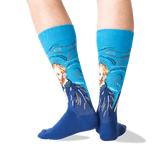 A person's legs wearing blue crew socks with a stylized portrait of Vincent van Gogh in a Van Gogh-inspired swirling composition, shown against a plain white background.