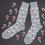Gray socks with candy cane and ice cream pattern on a black background