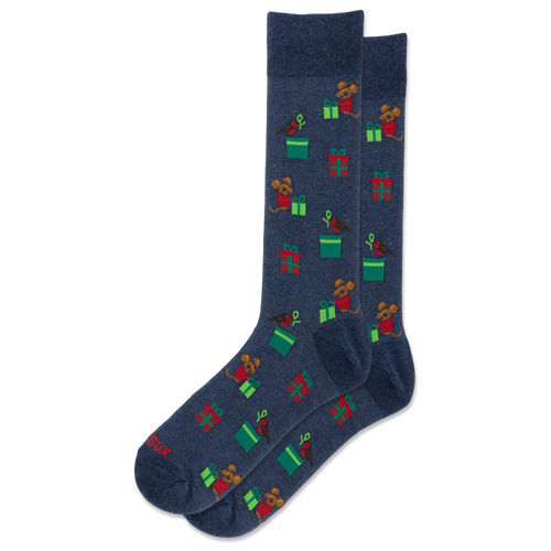 A pair of navy blue crew socks with a repeating pattern of cartoon bears opening green presents and wearing red hats, shown on a plain white background.