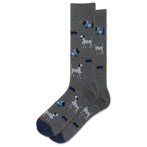 A pair of dark gray crew socks featuring a pattern of cartoon dalmatians wearing Hanukkah-inspired garments, shown against a plain white background.