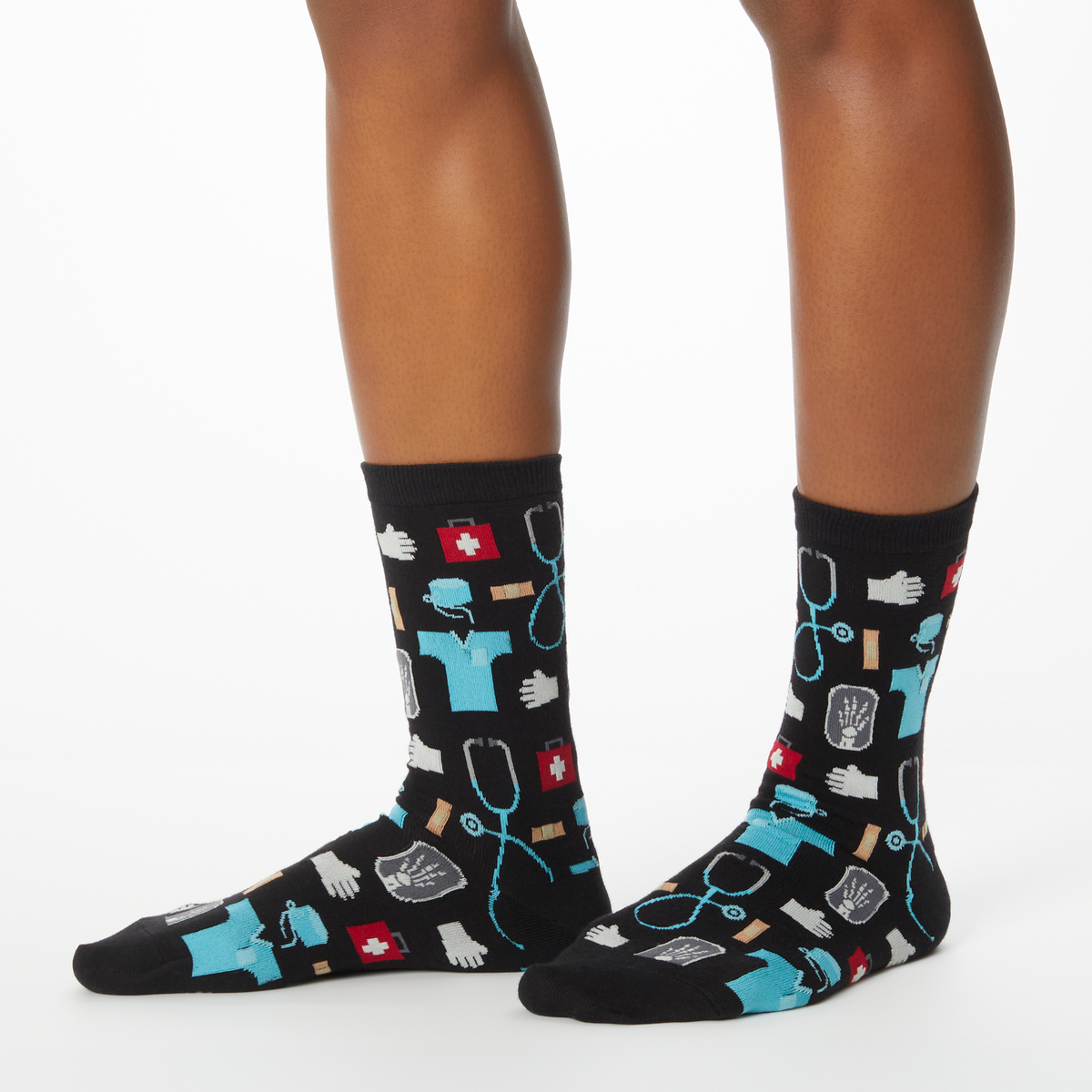 Woman wearing black socks with a repeat medical pattern