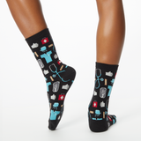 Woman wearing black socks with a repeat medical pattern thumbnail