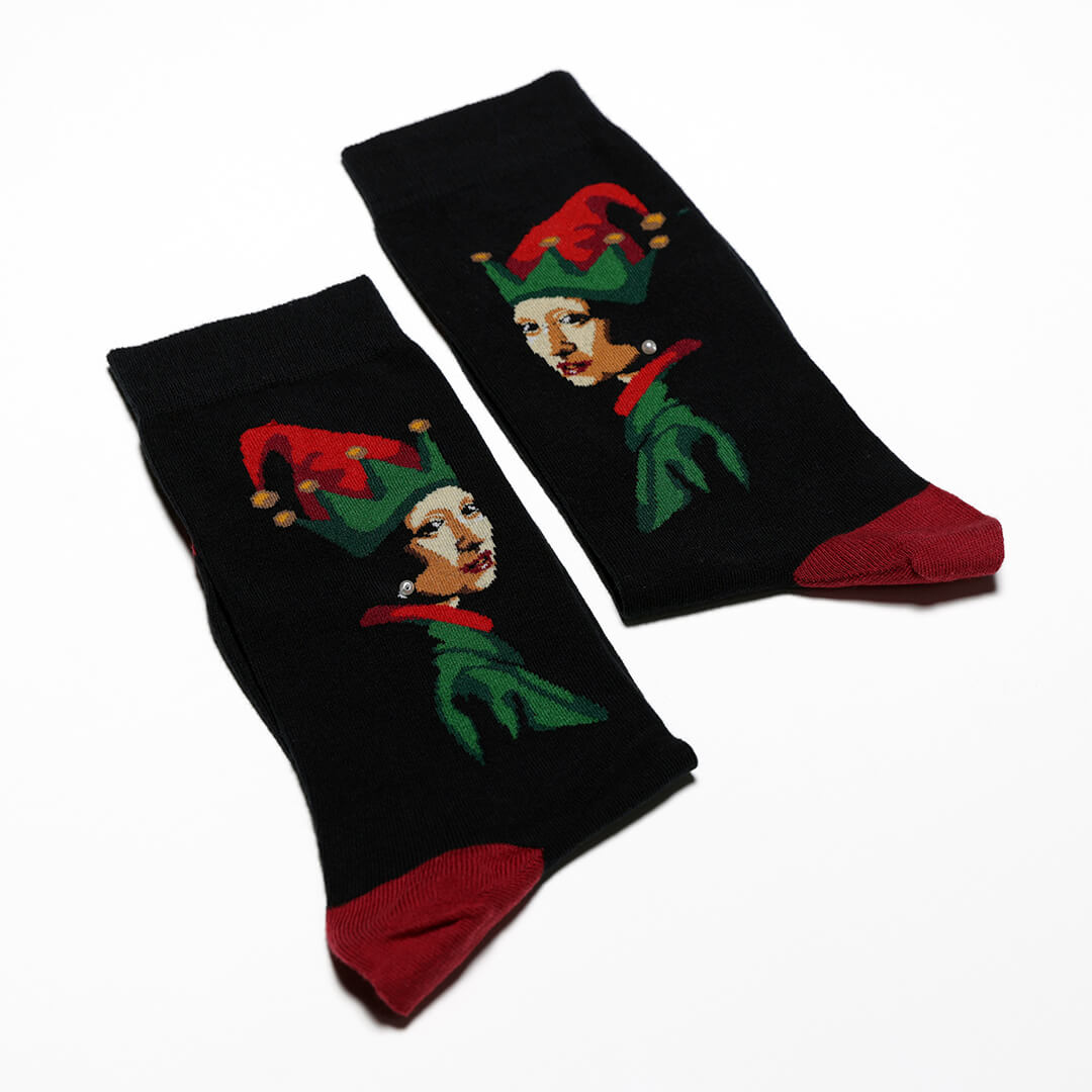 Pair of socks with elf design on a white background