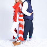 Two people wearing winter clothing on a white background thumbnail