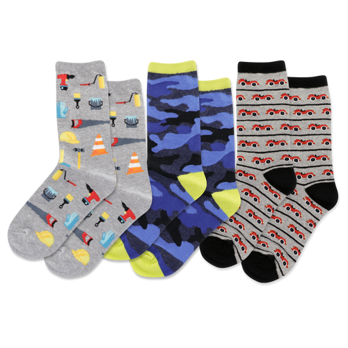 Three pairs of children's socks with different patterns on a white background