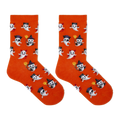 A pair of bright orange crew socks with an all-over Halloween ghost pattern, shown flat against a solid white background.