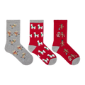 Three Christmas-themed crew socks displayed side-by-side on a plain white background. The left sock is heather gray with a pattern of skating reindeer.