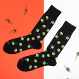 Black socks with an olive pattern on an orange and white background