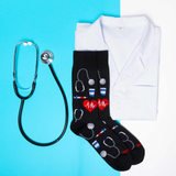 Black socks with medical design, white coat, and stethoscope on a blue and white background