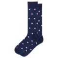 A pair of navy blue crew socks with a repeating pattern of small red and white boats on blue wavy lines, displayed on a clean white background.