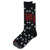 A pair of black crew socks with a gray and red graphic design featuring dumbbells and the text 'PRACTICE SAFE SETS' in red and gray.