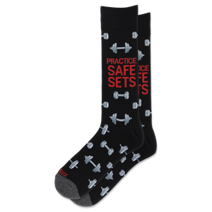 A pair of black crew socks with a gray and red graphic design featuring dumbbells and the text 'PRACTICE SAFE SETS' in red and gray.