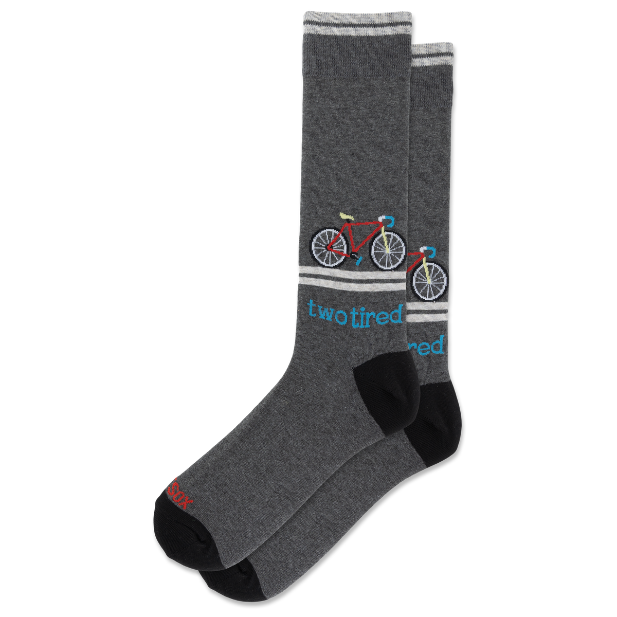 A pair of dark heather gray crew socks with black heels and toes, featuring a colorful bicycle graphic and the text 'two tired' in blue, on a plain white background.