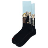 A pair of crew socks on a plain white background. The socks are black with Grant Woods' "American Gothic" on a light blue background, and a small red 'HOTSOX' logo near the toe.