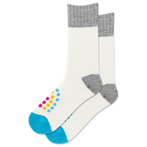 White sock with gray cuffs and toes, blue soles, and colorful polka dots on a white background