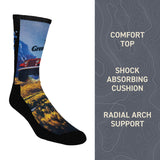 Sock with scenic design on a white background, featuring text about sock features. thumbnail