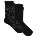 Two pairs of black crew socks with ruffled cuffs, one featuring a small pink and red floral pattern with green leaves, and the other solid black. The brand name 'it bell' is printed on the toe of the patterned sock.