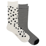 Two pairs of crew socks on a plain white background: one pair is white with small black heart patterns, and the other pair has black and white horizontal stripes. The brand name 'k bell' is printed on the toe area of the heart-patterned sock. thumbnail