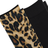 Close-up of folded knit socks, one with a leopard-print pattern in beige, brown, and black alongside a solid black sock on a white background. thumbnail