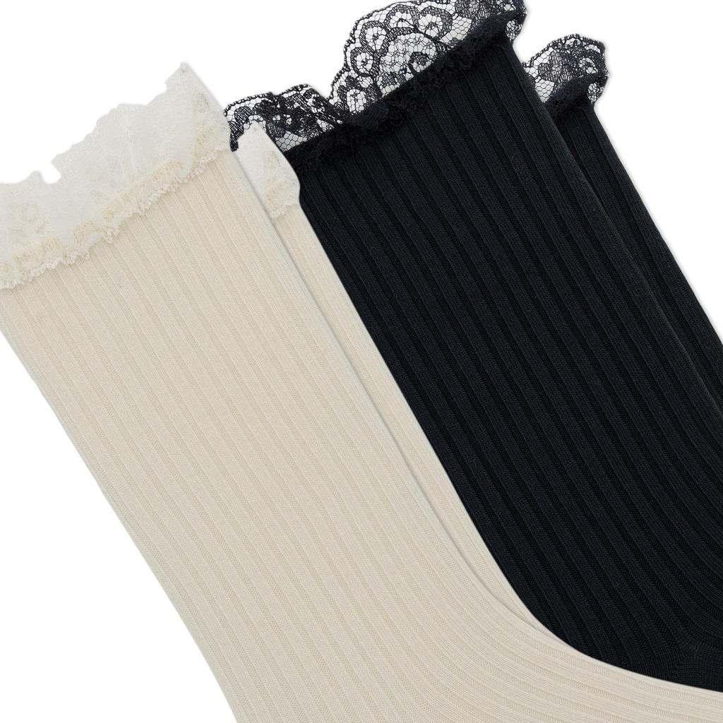 Two ribbed lace-trimmed socks shown diagonally on a white background, one in cream and one in black.