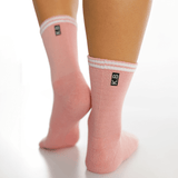 Pink socks with white stripes and a logo on a white background thumbnail