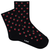 Black socks with red strawberry pattern and 'k.bell' branding on a white background