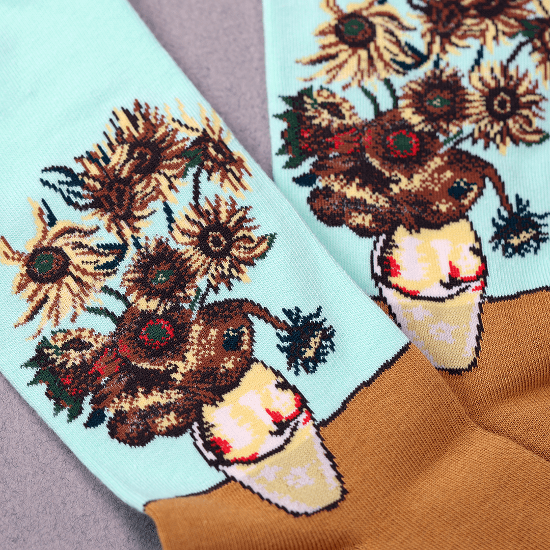 Socks with sunflower and bear design on a light blue background