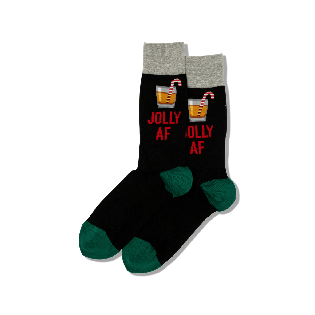 Black socks with red text and candy cane designs on a white background