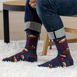 Person wearing blue socks with Thanksgiving-themed design on a white carpet thumbnail