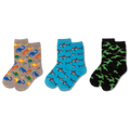 Gray socks with colorful dinosaur pattern worn by a child in denim jeans.