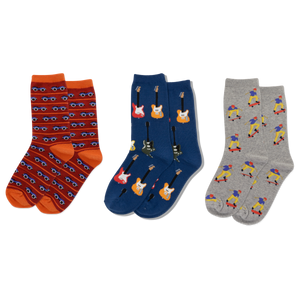 Three pairs of socks with cars, guitars and kateboarder patterns on a white background