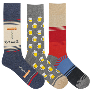 Three pairs of novelty crew socks displayed side by side on a plain white background. The left sock is navy blue with a beige section featuring a corkscrew graphic, the text 'Screw it', and a small bone detail.