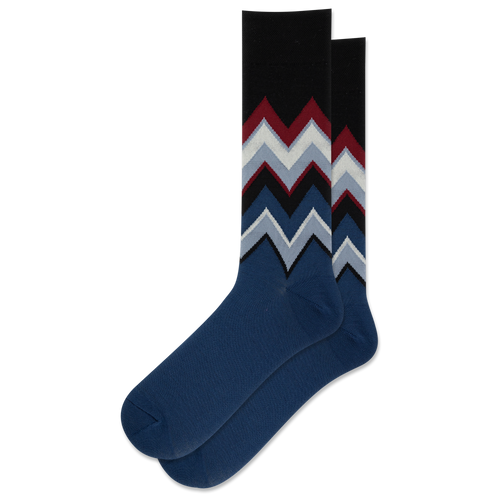 A pair of wool socks with zigzag chevron patterns on a green and blue background