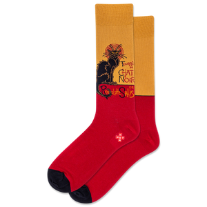 Red socks with a black cat design on a mustard background