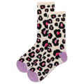 Leopard print socks with pink accents on a beige background