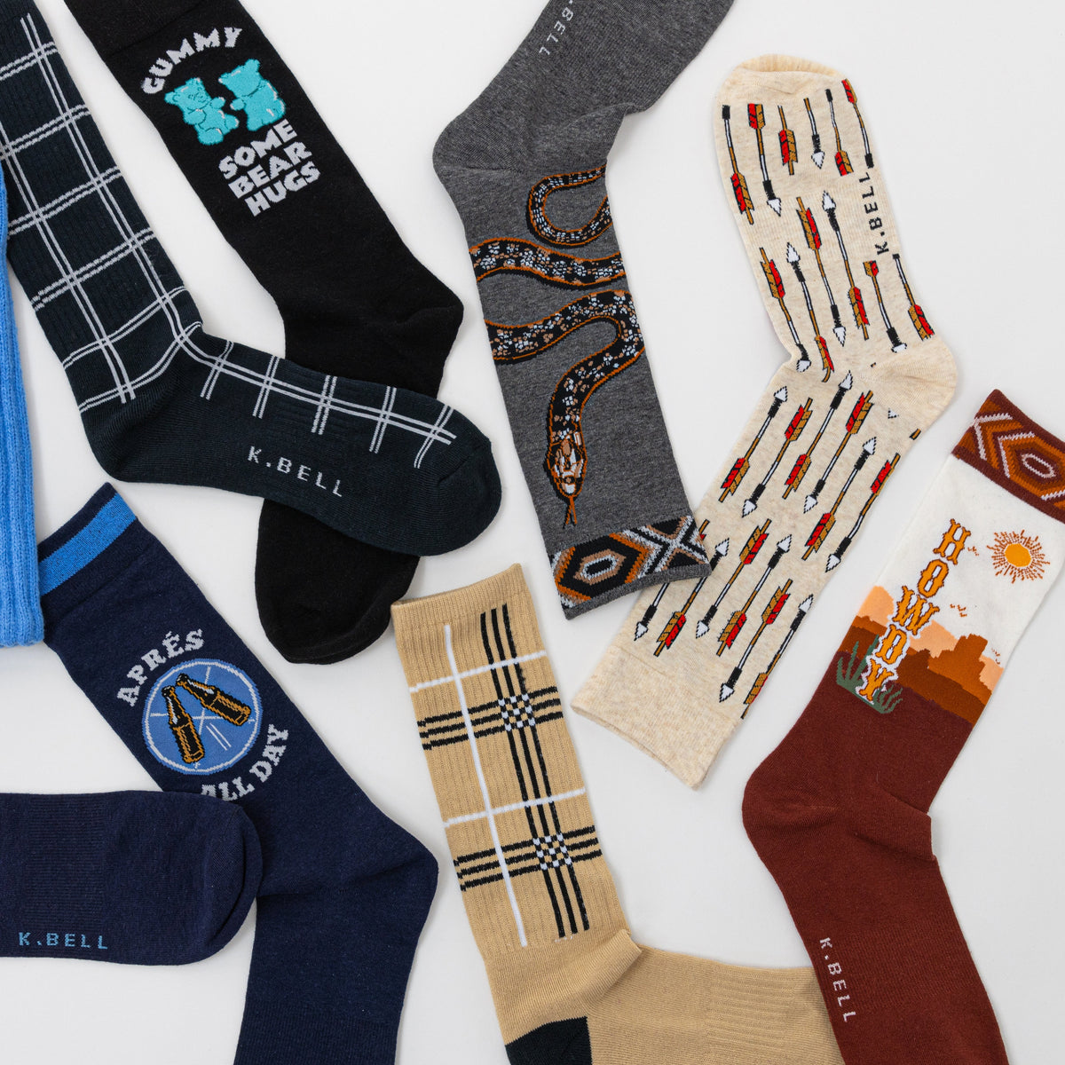 Collection of various socks with different designs and colors on a white background