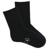 Pair of black socks with a smiley face and initials on a white background
