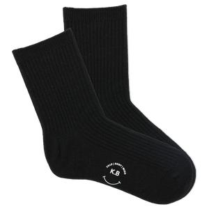 Pair of black socks with a smiley face and initials on a white background