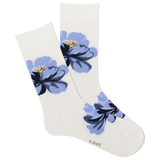A pair of white crew socks with a blue floral pattern.